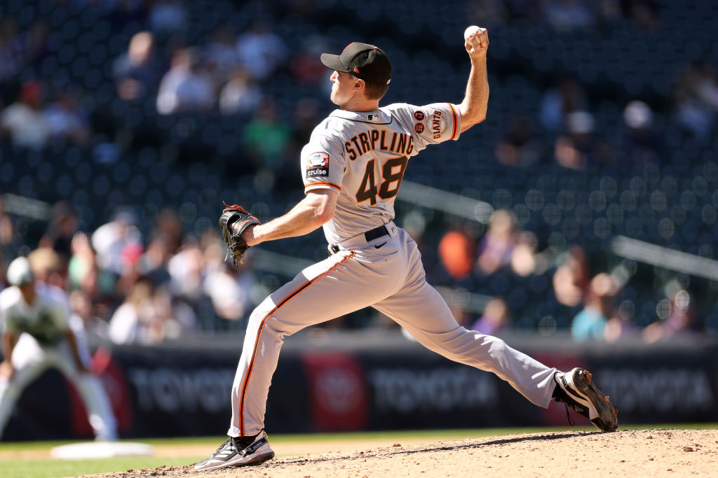 Ross Stripling #48 of the San Francisco Giants throws against the Colorado Rockies in the sixth inn...