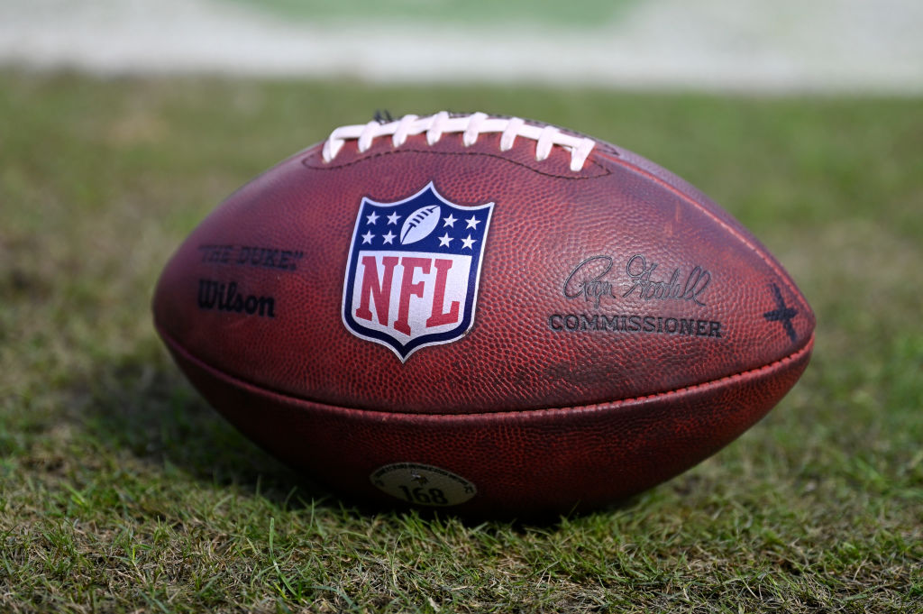 A detailed view of the NFL logo on a football prior to the game between the Minnesota Vikings and t...