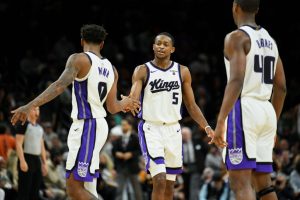 PHOENIX, ARIZONA - DECEMBER 08: De'Aaron Fox #5 of the Sacramento Kings high fives Malik Monk #0 during the second half of the NBA game against the Phoenix Suns at Footprint Center on December 08, 2023 in Phoenix, Arizona. NOTE TO USER: User expressly acknowledges and agrees that, by downloading and or using this photograph, User is consenting to the terms and conditions of the Getty Images License Agreement. (Photo by Kelsey Grant/Getty Images)