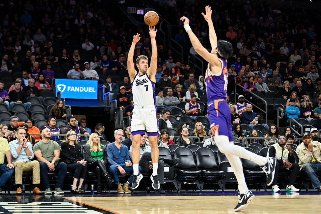 Sasha Vezenkov #7 of the Sacramento Kings shoots a three pointer against the Phoenix Suns during th...