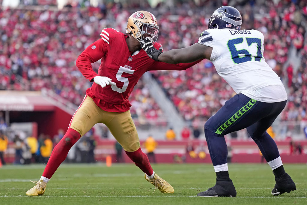 Randy Gregory #5 of the San Francisco 49ers goes up against Charles Cross #67 of the Seattle Seahaw...