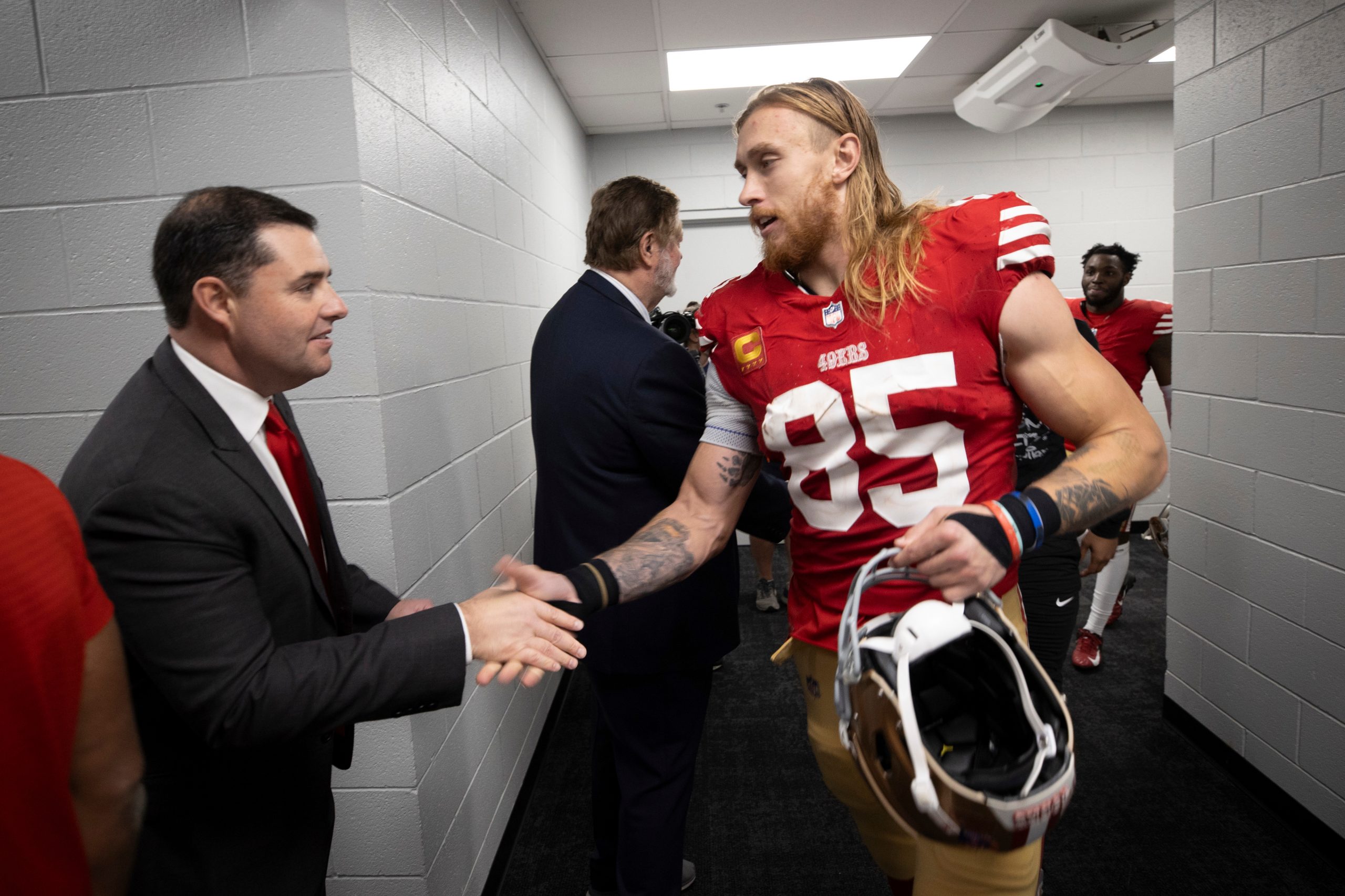 CEO Jed York and George Kittle #85 of the San Francisco 49ers in the locker room after the game aga...