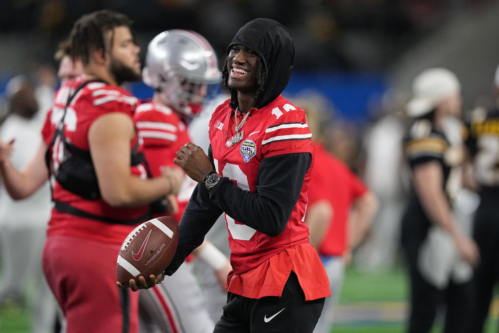 Marvin Harrison Jr. #18 of the Ohio State Buckeyes reacts prior to a game against the Missouri Tige...