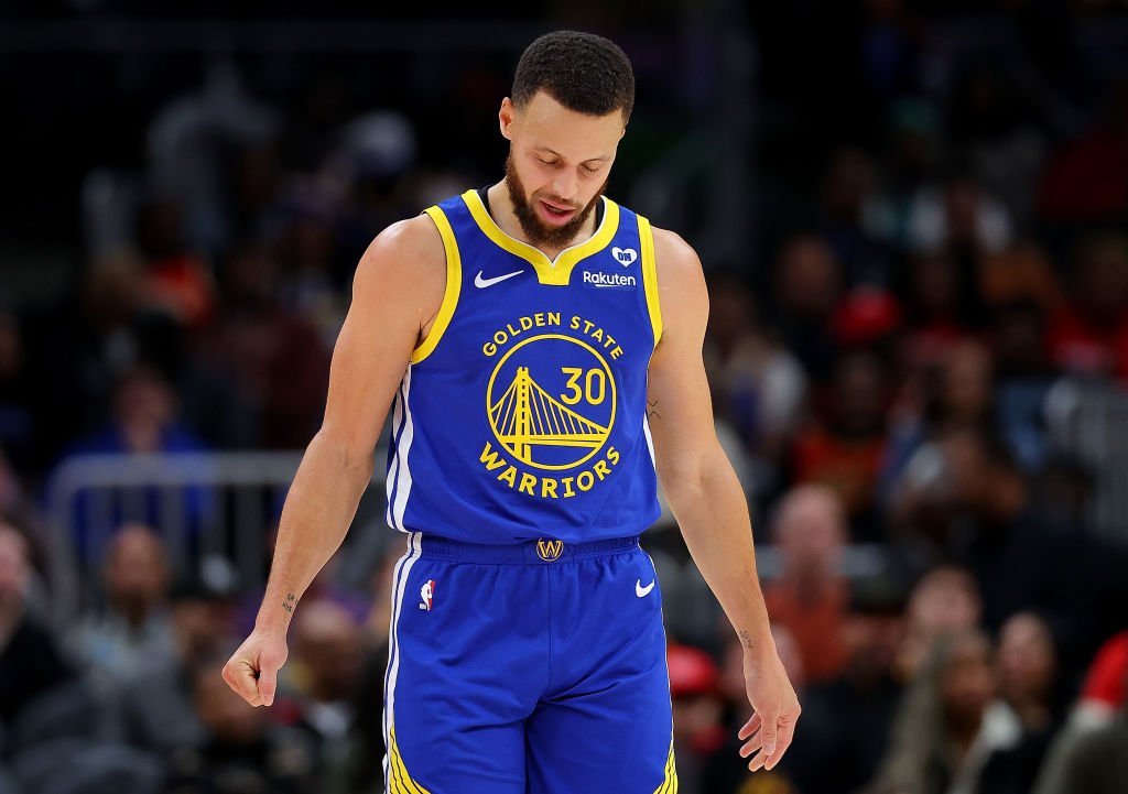 Stephen Curry #30 of the Golden State Warriors reacts against the Atlanta Hawks during the first qu...