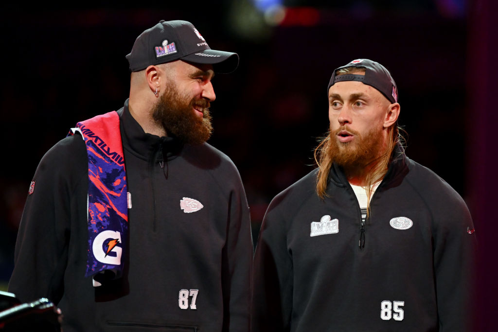 Travis Kelce of the Kansas City Chiefs (L) and George Kittle of the San Francisco 49ers meet on sta...