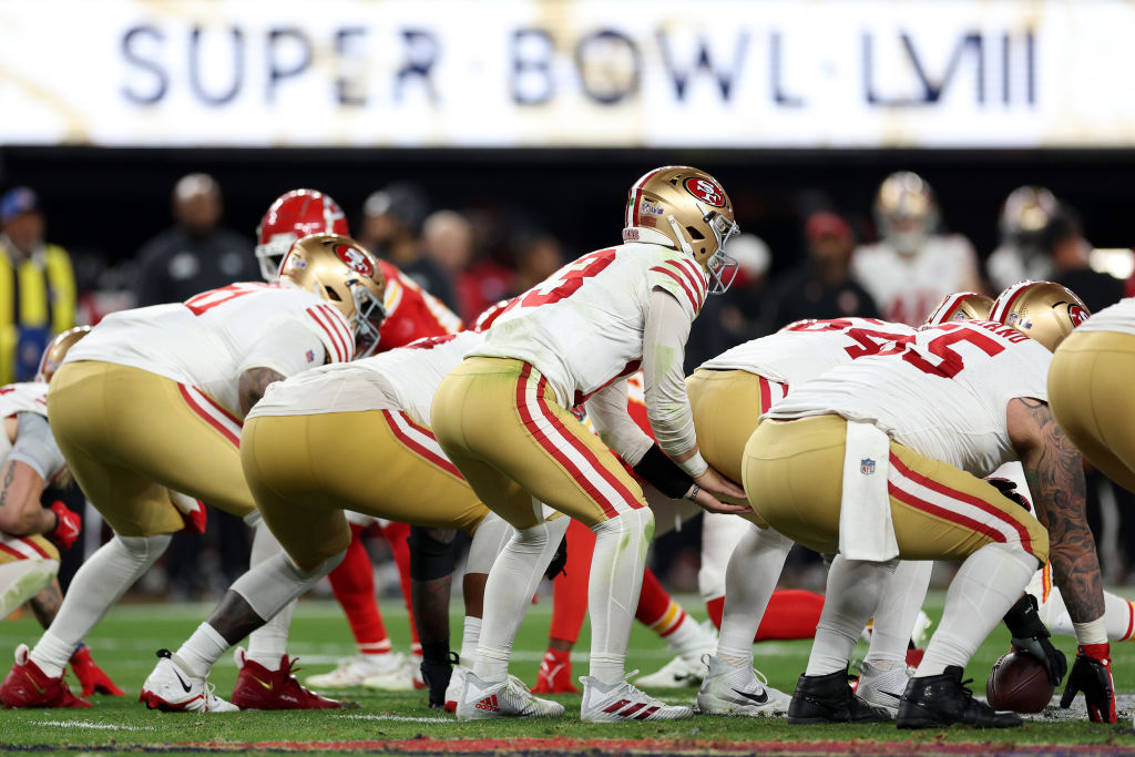 Brock Purdy #13 of the San Francisco 49ers prepares to snap the ball during the fourth quarter agai...