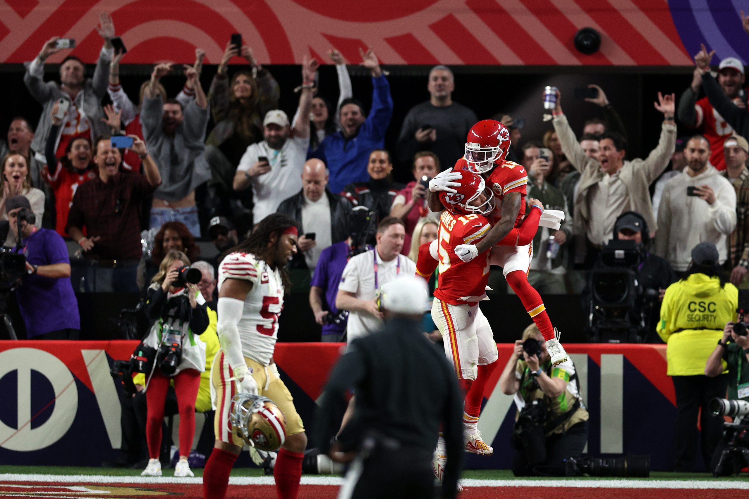 Mecole Hardman Jr. #12 of the Kansas City Chiefs celebrates a touchdown with Patrick Mahomes #15 to...