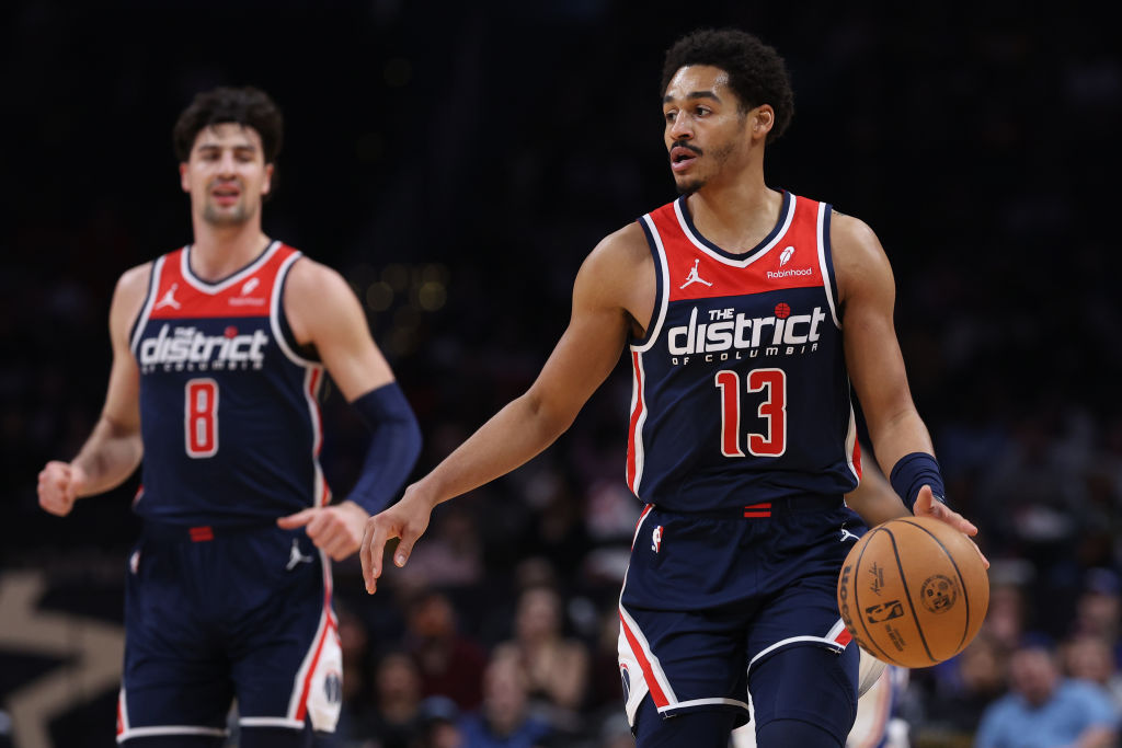 Jordan Poole #13 of the Washington Wizards dribbles the ball against the Philadelphia 76ers during ...
