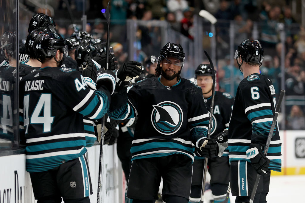 Anthony Duclair #10 of the San Jose Sharks is congratulated by teammates after he scored against th...