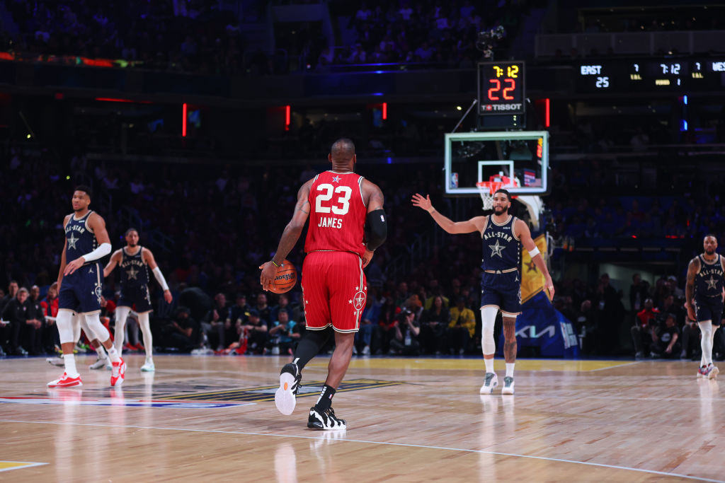 LeBron James #23 of the Los Angeles Lakers and Western Conference All-Stars dribbles the ball again...