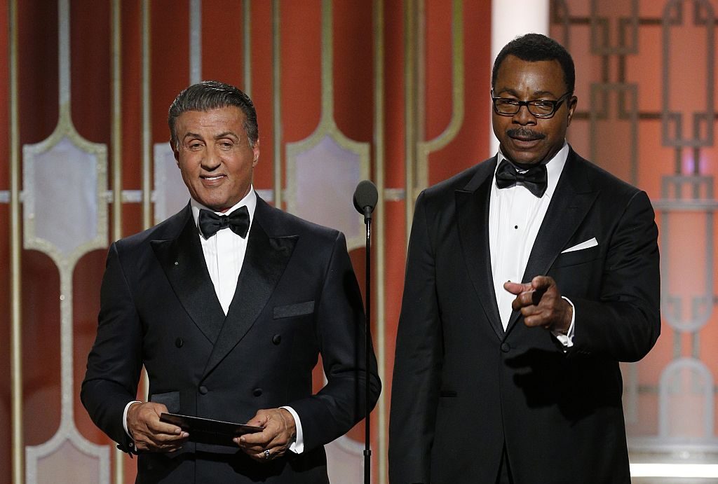 Sylvester Stallone (L) and Carl Weathers, who co-starred in the 1977 Golden Globe Award-winning fil...