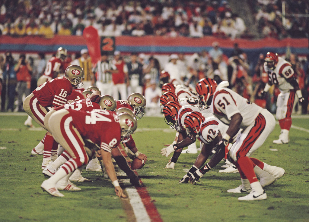 Joe Montana #16, Quarterback for the San Francisco 49ers calls the play on the line of scrimmage du...