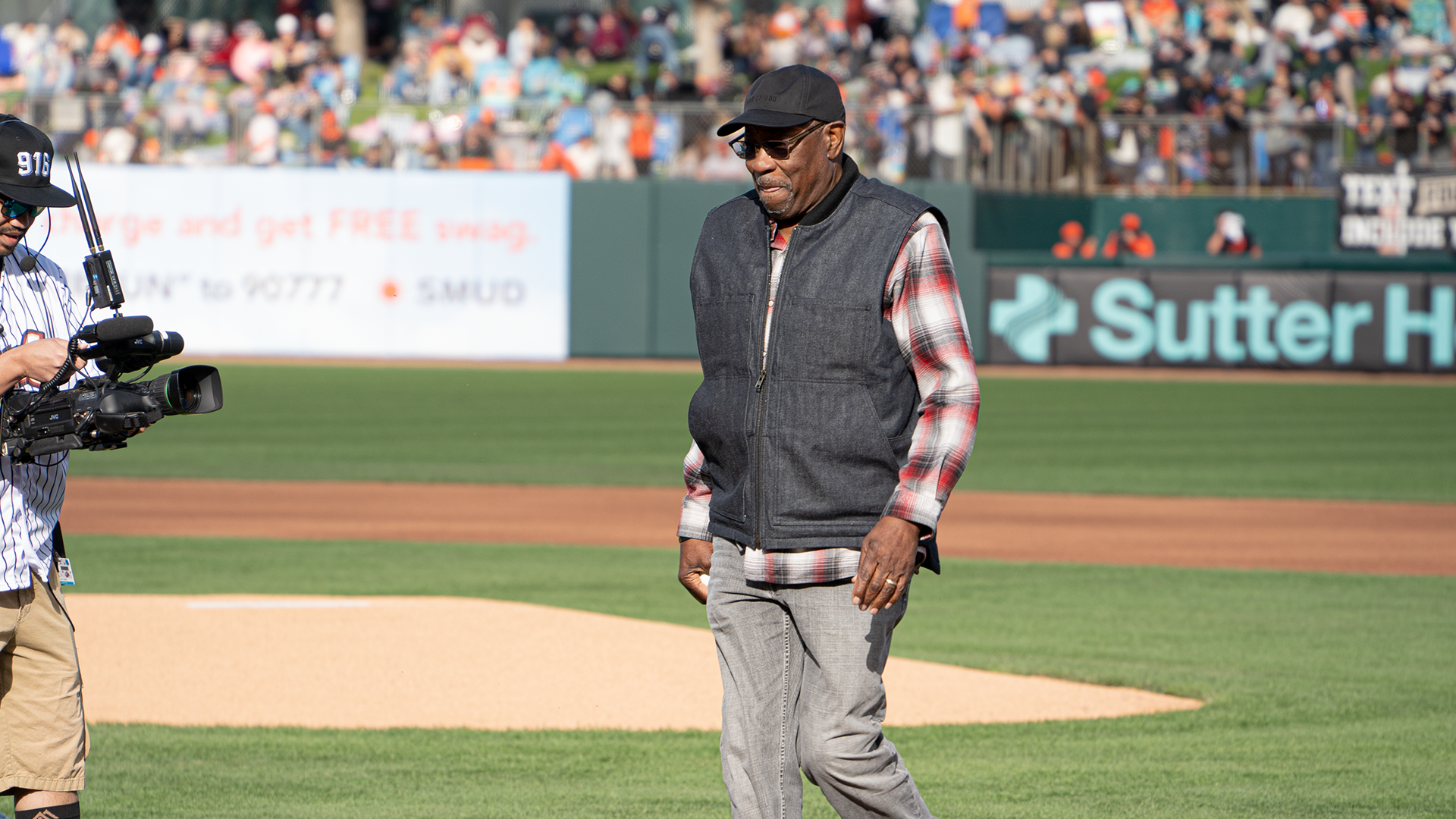 Former Giants manager Dusty Baker throws out the first pitch at Sutter Health Park...