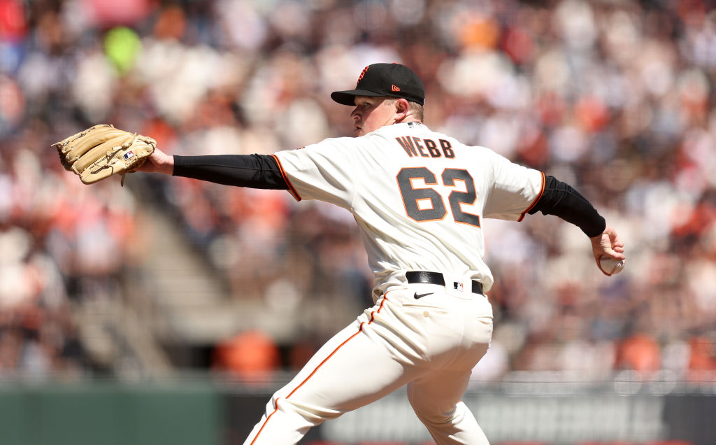 Logan Webb #62 of the San Francisco Giants pitches against the Miami Marlins during MLB opening day...