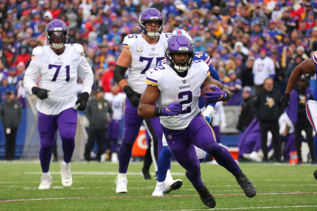Alexander Mattison #2 of the Minnesota Vikings runs after a catch during the second quarter against...