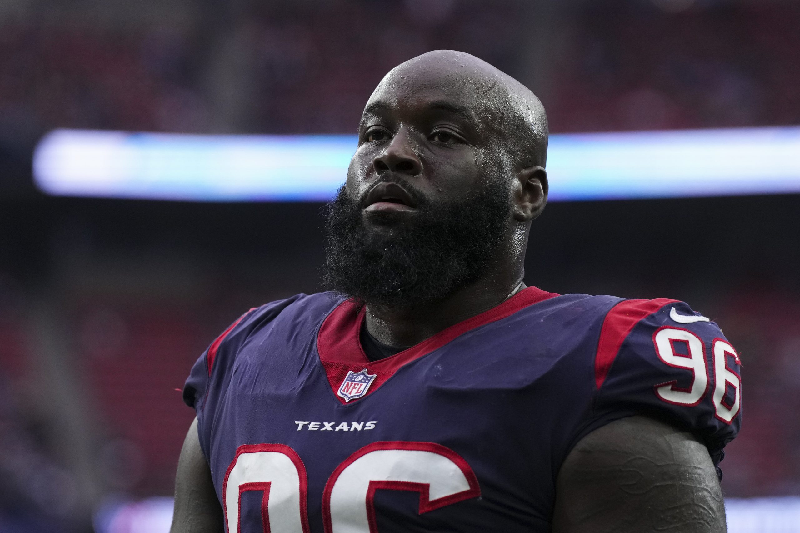 Maliek Collins #96 of the Houston Texans walks off of the field against the Washington Commanders a...