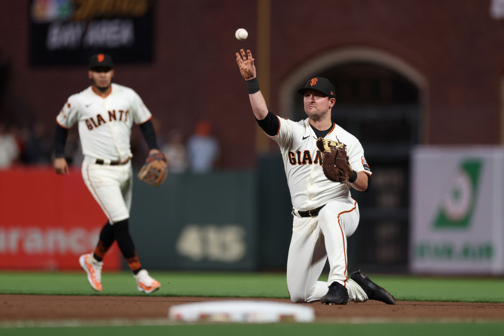 J.D. Davis #7 of the San Francisco Giants throws out Ji Man Choi #91 of the San Diego Padres in the...