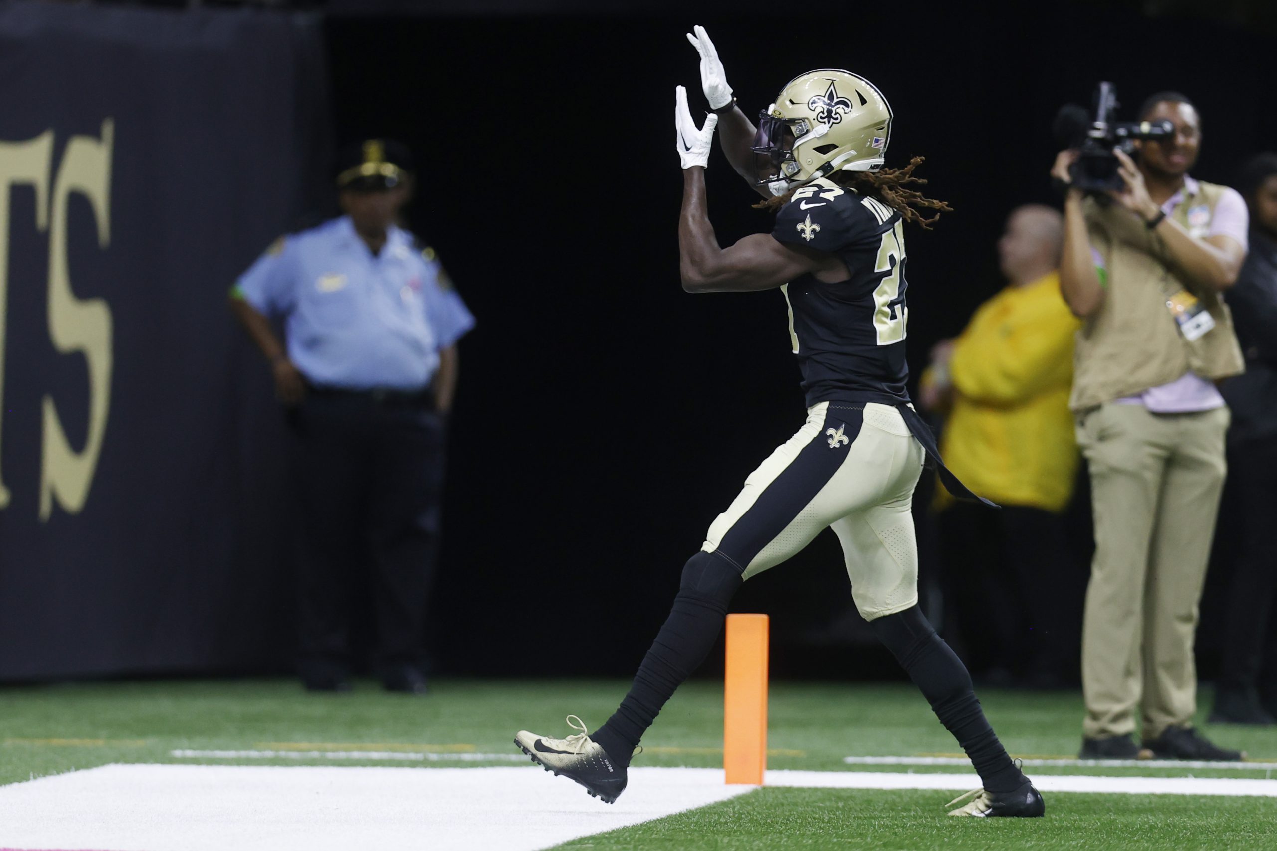 Isaac Yiadom #27 of the New Orleans Saints celebrates after a play during the first half against th...