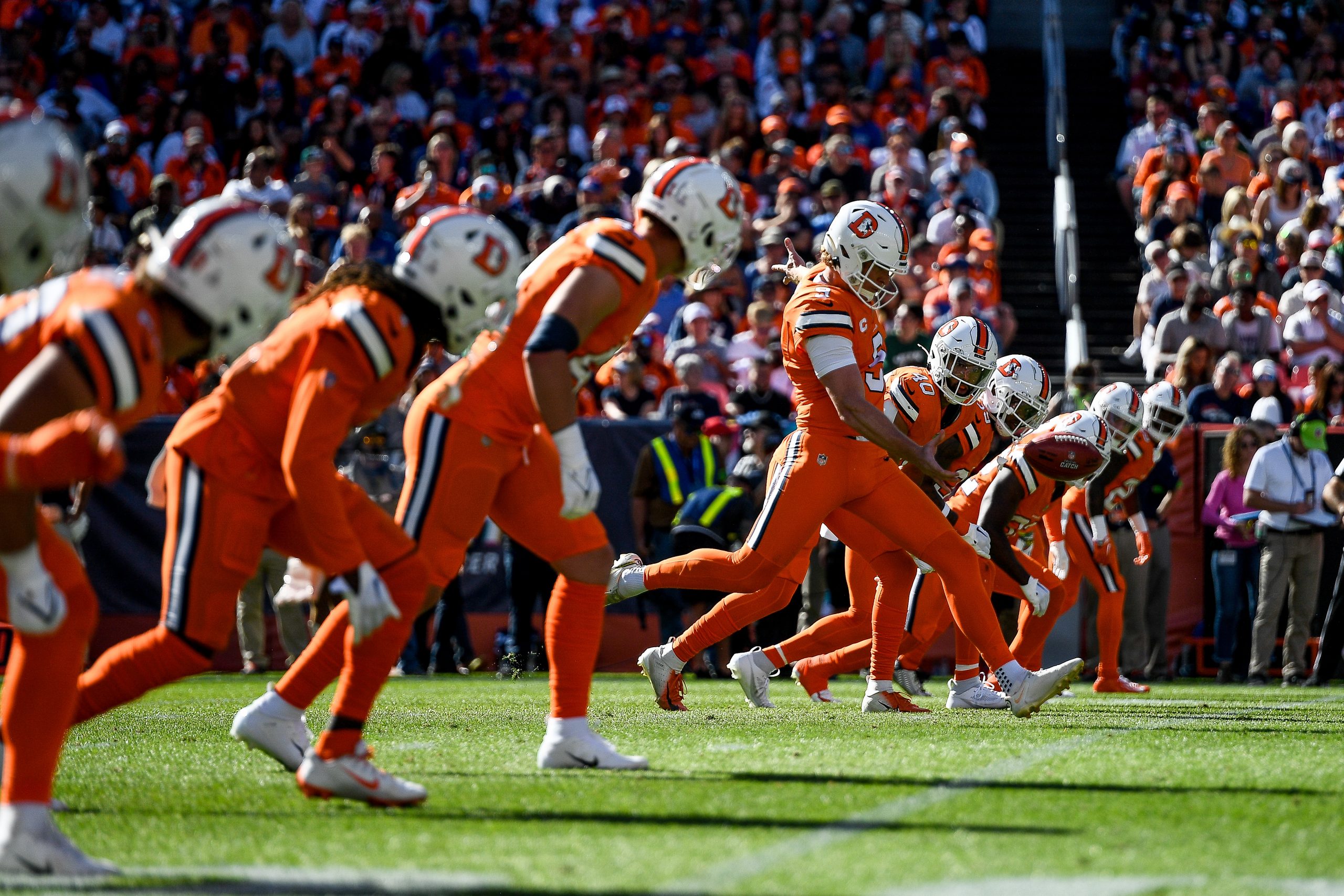 Denver Broncos punter Riley Dixon (9) kicks off on a drop kick kickoff after a safety in the first ...