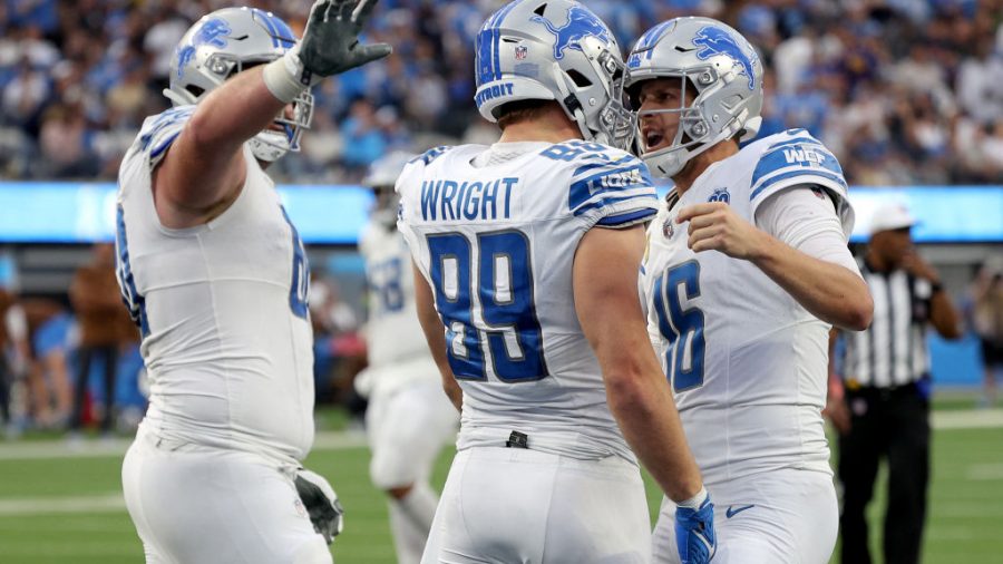 Jared Goff #16 of the Detroit Lions celebrates a touchdown pass with Brock Wright #89 of the Detroit Lions during the fourth quarter against the Los Angeles Chargers at SoFi Stadium on November 12, 2023 in Inglewood, California.