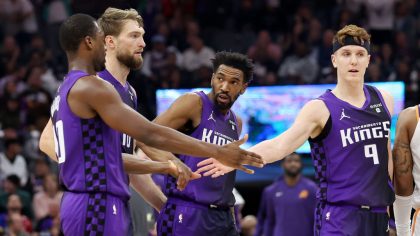 SACRAMENTO, CALIFORNIA - DECEMBER 22: Harrison Barnes #40, Domantas Sabonis #10, Malik Monk #0 and Kevin Huerter #9 of the Sacramento Kings high-five during their game against the Phoenix Suns at Golden 1 Center on December 22, 2023 in Sacramento, California. NOTE TO USER: User expressly acknowledges and agrees that, by downloading and or using this photograph, User is consenting to the terms and conditions of the Getty Images License Agreement. (Photo by Ezra Shaw/Getty Images)