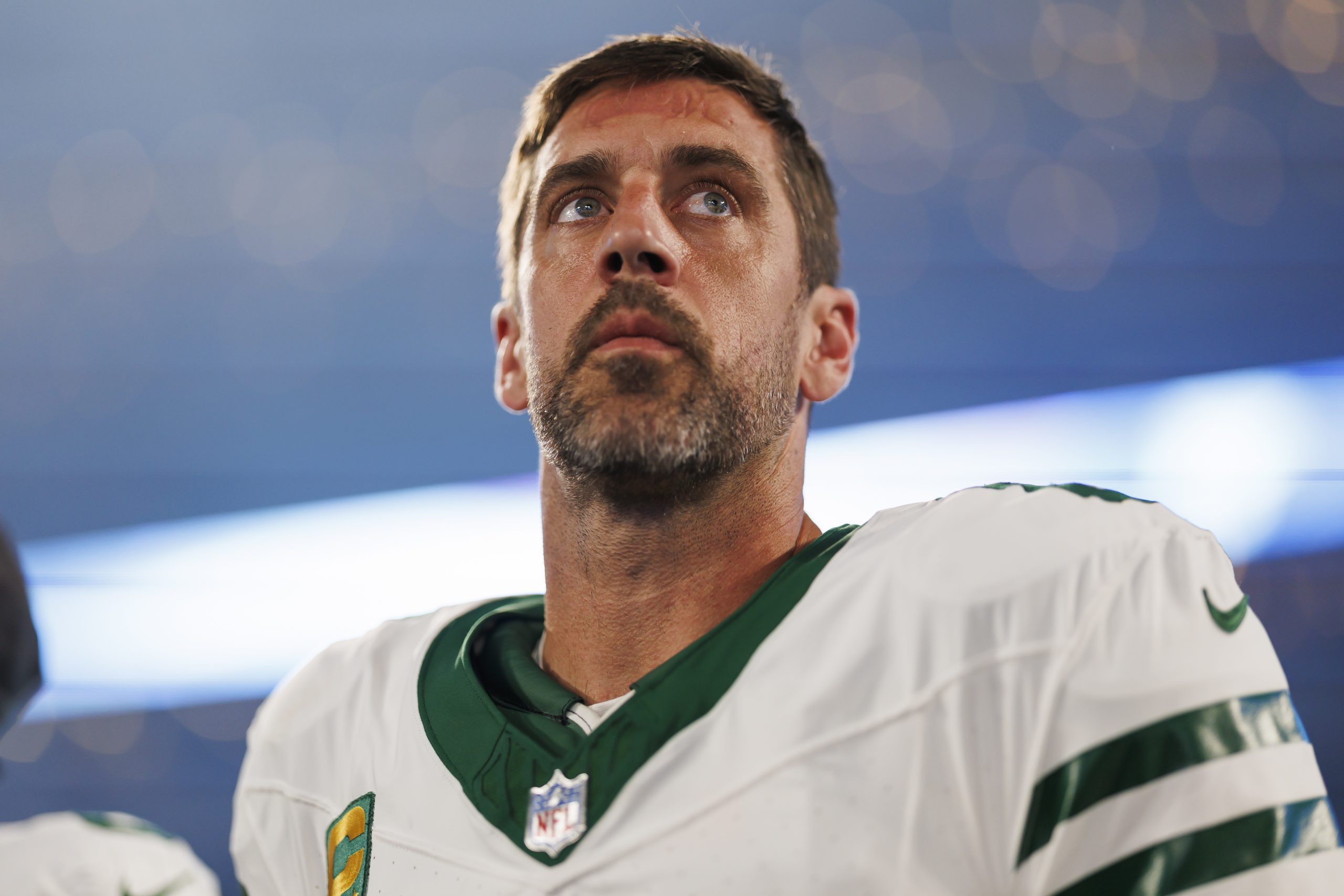 Aaron Rodgers #8 of the New York Jets looks on from the sideline prior to an NFL football game agai...