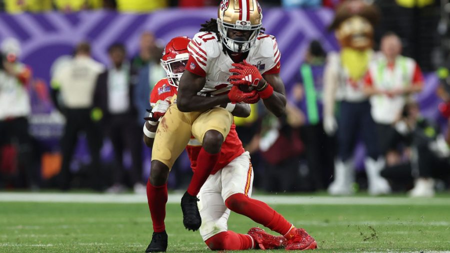 Brandon Aiyuk #11 of the San Francisco 49ers catches a pass for a first down in overtime against the Kansas City Chiefs during Super Bowl LVIII at Allegiant Stadium on February 11, 2024 in Las Vegas, Nevada.