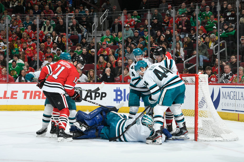 Goalie Devin Cooley #1 of the San Jose Sharks falls down in the third period against the Chicago Bl...