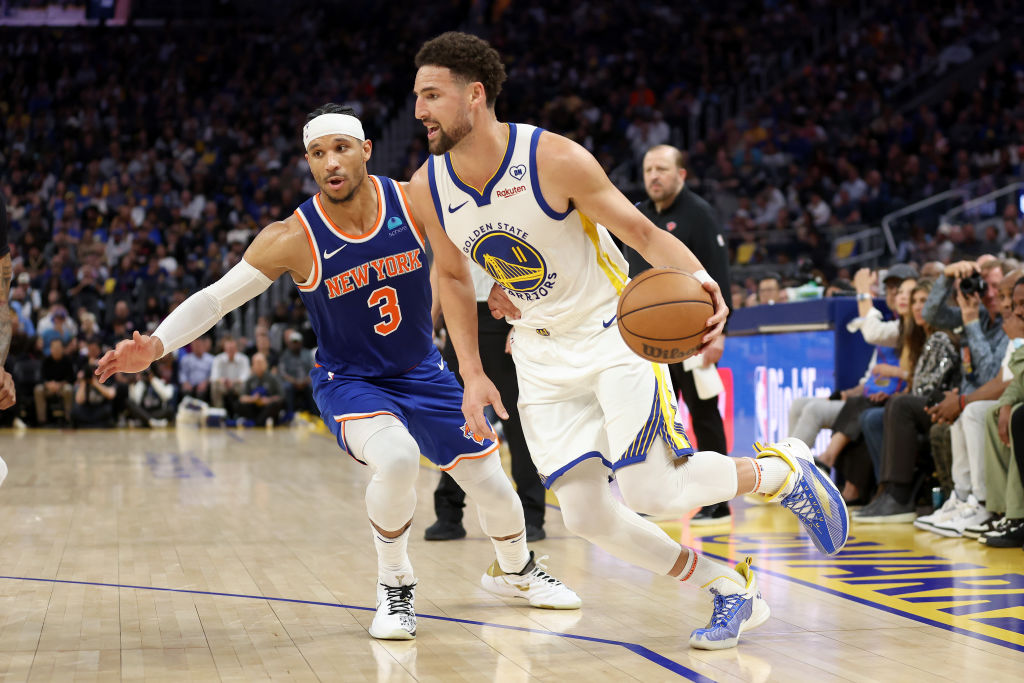Klay Thompson #11 of the Golden State Warriors is guarded by Josh Hart #3 of the New York Knicks in...