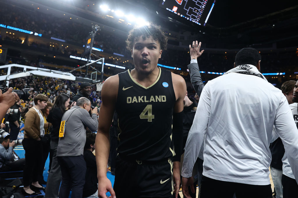 Trey Townsend #4 of the Oakland Golden Grizzlies reacts as he walks off the court after defeating t...