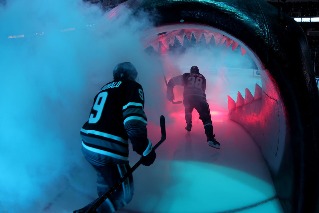 Jacob MacDonald #9 and Mario Ferraro #38 of the San Jose Sharks skate onto the ice for their game a...