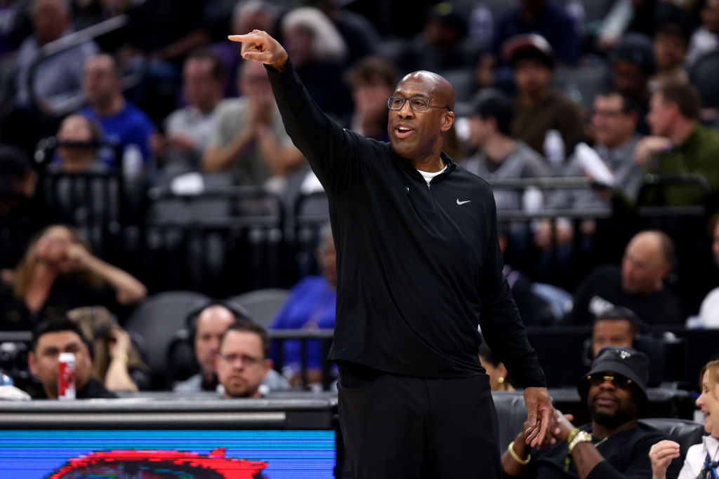 Sacramento Kings head coach Mike Brown points to his team during their game against the Philadelphi...