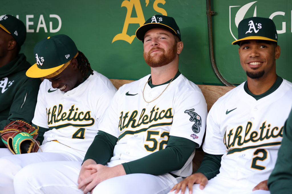 Kyle McCann #52 of the Oakland Athletics sits in the dugout before their game against the Cleveland...
