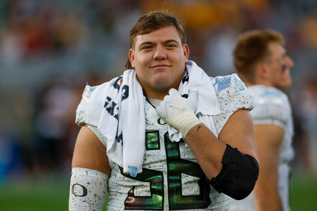 Jackson Powers-Johnson #58 of the Oregon Ducks smiles during a game against the Arizona State Sun D...