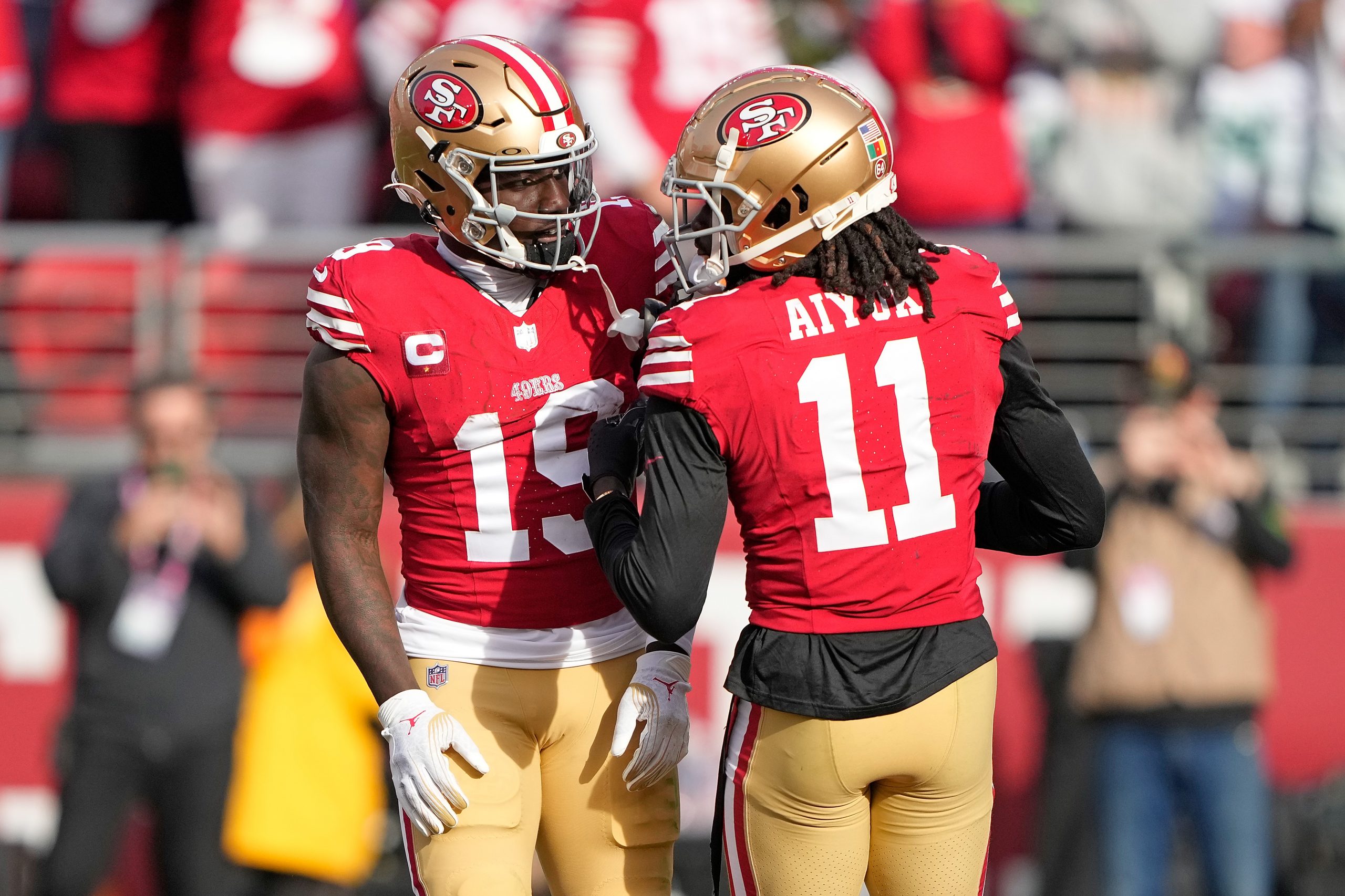 Deebo Samuel #19 of the San Francisco 49ers celebrates a touchdown with Brandon Aiyuk #11 during th...