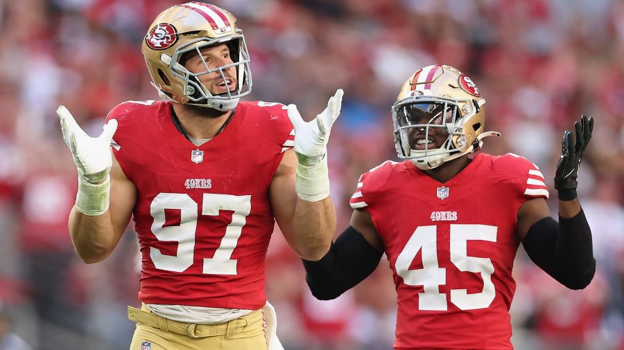 Defensive end Nick Bosa #97 and linebacker Demetrius Flannigan-Fowles #45 of the San Francisco 49ers react during the NFL game at State Farm Stadium on December 17, 2023 in Glendale, Arizona. The 49ers defeated the Cardinals 45-29.