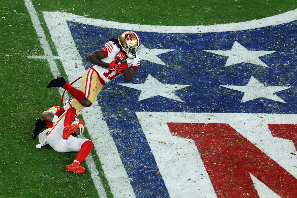 Brandon Aiyuk #11 of the San Francisco 49ers runs the ball after a catch for a first down in overti...
