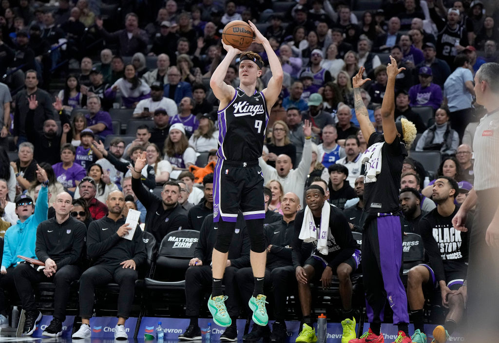 Kevin Huerter #9 of the Sacramento Kings shoots a three-point shot against the San Antonio Spurs in...