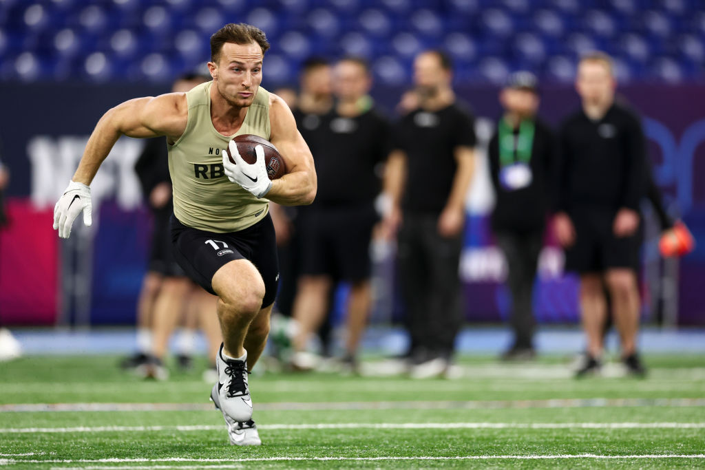 Dylan Laube #RB17 of New Hampshire participates in a drill during the NFL Combine at the Lucas Oil ...