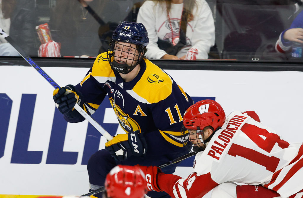 Collin Graf #11 of the Quinnipiac Bobcats skates against the Wisconsin Badgers during the NCAA Divi...