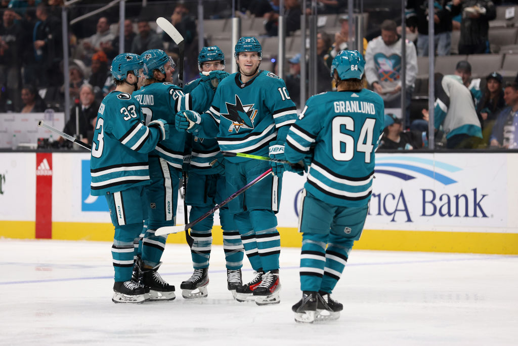Klim Kostin #10 of the San Jose Sharks is congratulated by teammates after he scored a goal against...