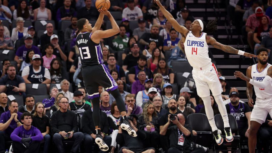 SACRAMENTO, CALIFORNIA - APRIL 02: Keegan Murray #13 of the Sacramento Kings shoots over Terance Mann #14 of the LA Clippers in the first half at Golden 1 Center on April 02, 2024 in Sacramento, California. NOTE TO USER: User expressly acknowledges and agrees that, by downloading and or using this photograph, User is consenting to the terms and conditions of the Getty Images License Agreement. (Photo by Ezra Shaw/Getty Images)