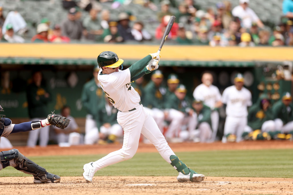 Tyler Nevin #26 of the Oakland Athletics hits a single against the Boston Red Sox in the fifth inni...