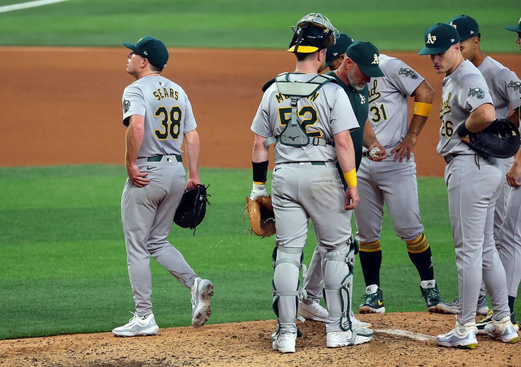 JP Sears #38 of the Oakland Athletics exits the game in the seventh inning against the Texas Ranger...