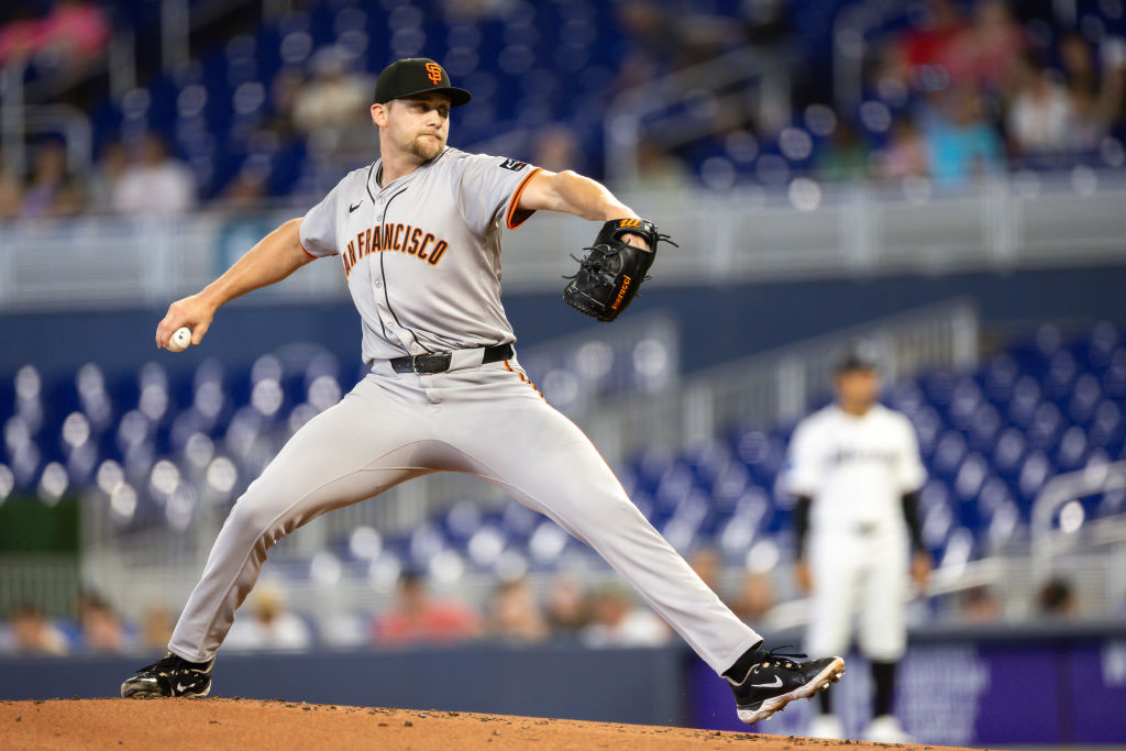 Keaton Winn #67 of the San Francisco Giants pitches against the Miami Marlins during the first inni...
