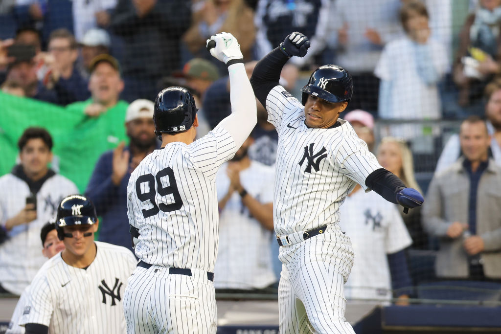 NEW YORK, NEW YORK - APRIL 24: Aaron Judge #99 of the New York Yankees celebrates with Juan Soto #2...