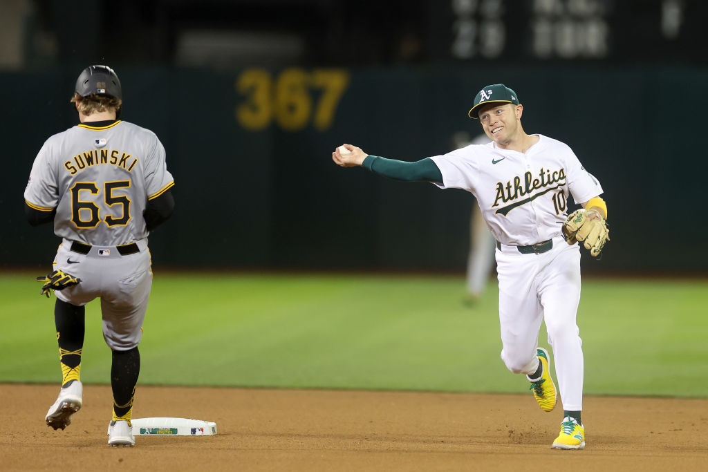 OAKLAND, CALIFORNIA - APRIL 29: Nick Allen #10 of the Oakland Athletics turns a double play as Jack...