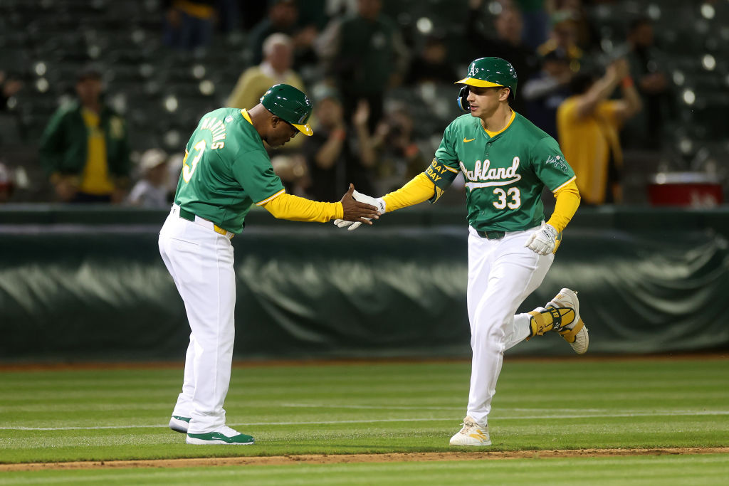 OAKLAND, CALIFORNIA - APRIL 30: JJ Bleday #33 of the Oakland Athletics is congratulated by third ba...