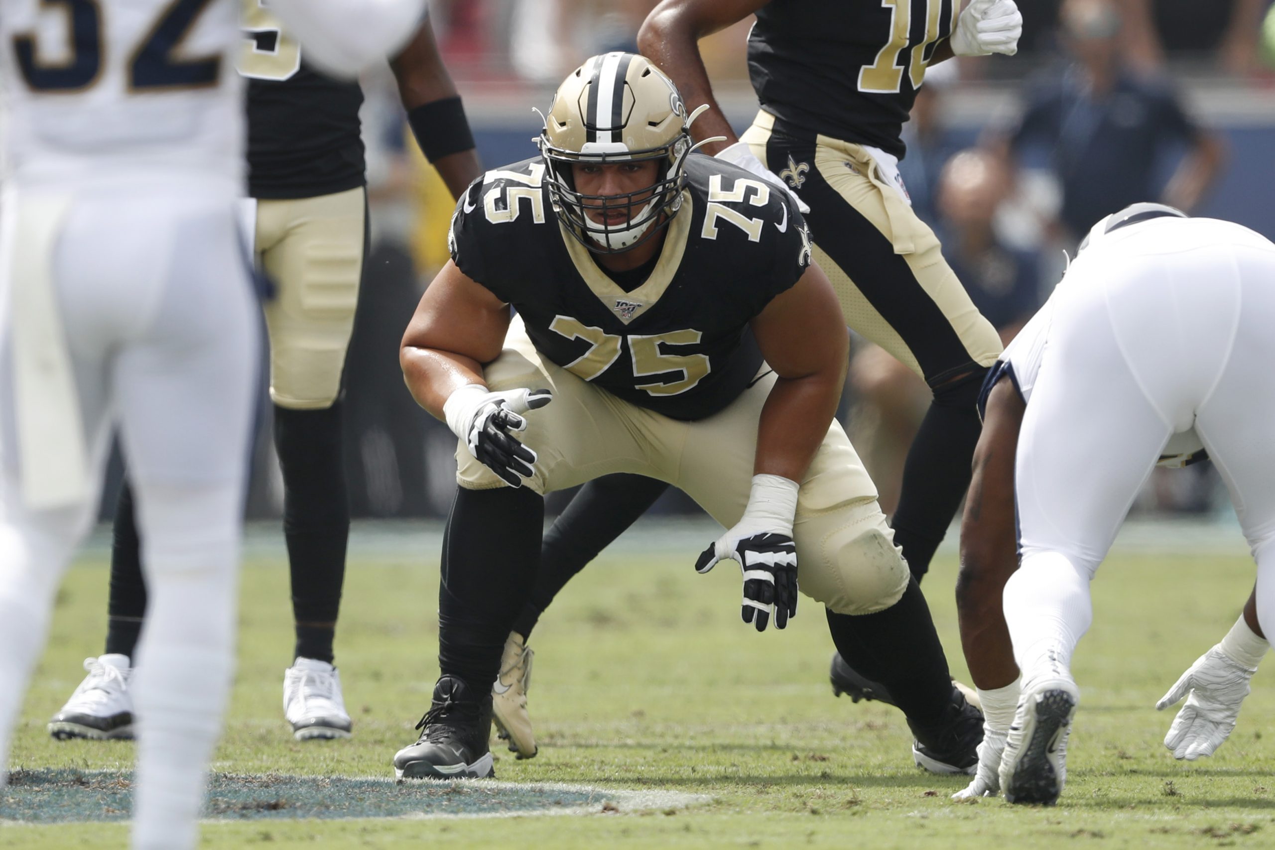 Andrus Peat #75 of the New Orleans Saints lines up on the line of scrimmage during the first half o...