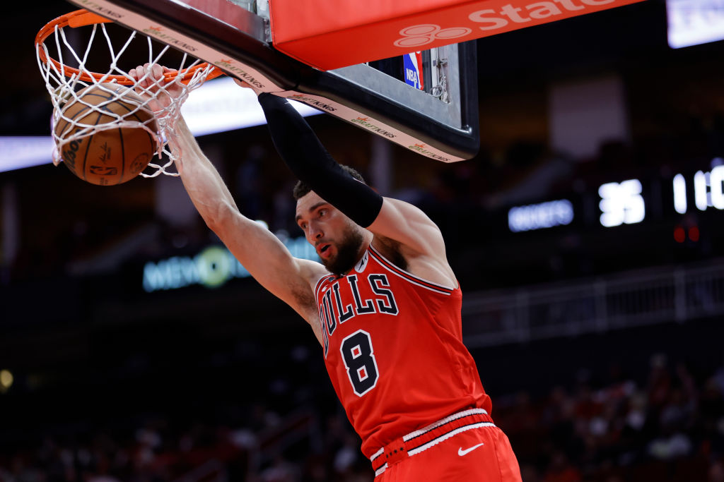 HOUSTON, TEXAS - MARCH 11: Zach LaVine #8 of the Chicago Bulls dunks the ball against the Houston R...